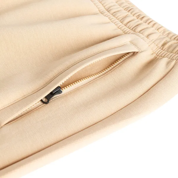 Anta KAI beige pantalon largo foto bolsillo