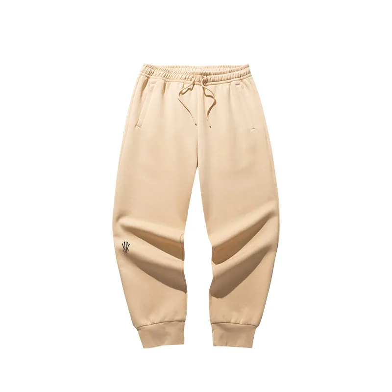 Anta KAI beige pantalon largo foto frontal